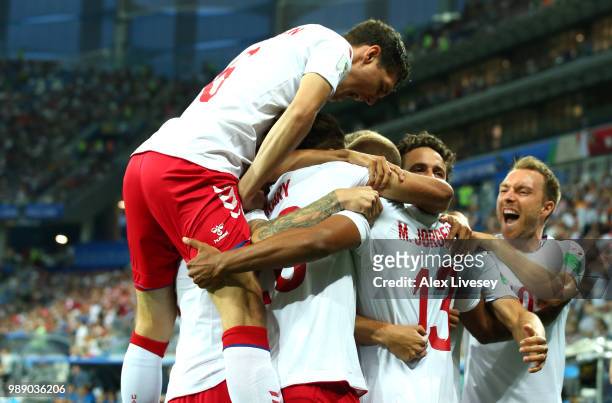 Mathias Jorgensen of Denmark celebrates with teammates after scoring his team's first goal during the 2018 FIFA World Cup Russia Round of 16 match...