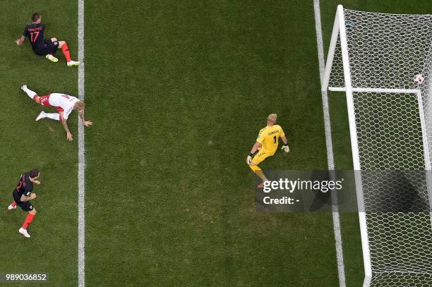 Croatia's forward Mario Mandzukic scores a goal during the Russia 2018 World Cup round of 16 football match between Croatia and Denmark at the Nizhny...