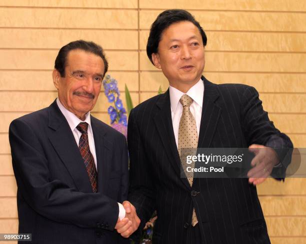 Japanese Prime Minister Yukio Hatoyama shakes hands with Saudi Economy and Planning Minister Khalid bin Muhammad al-Qusaybi at Hatoyama's official...