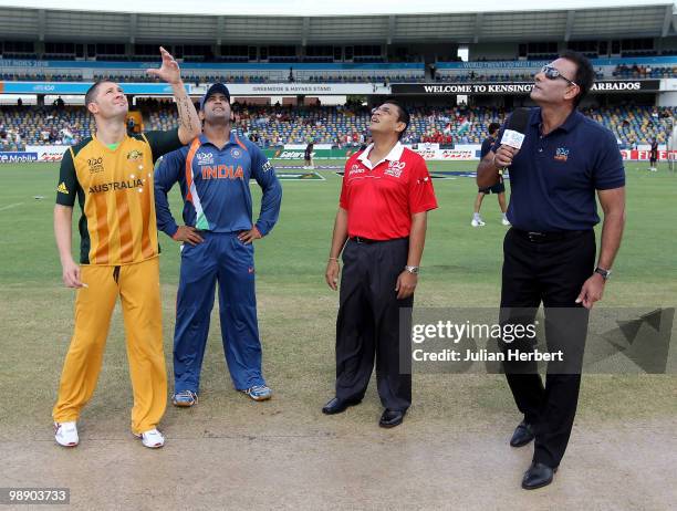 Michael Clarke of Australia is watched by M S Dhoni as he tosses the coin beforemThe ICC World Twenty20 Super Eight Match between Australia and India...