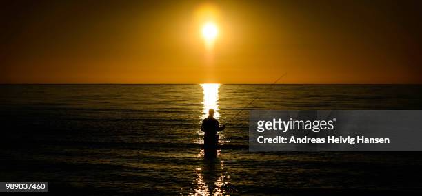 sunset fishing - andreas solar stock pictures, royalty-free photos & images