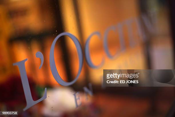 The logo of French cosmetics comany L'Occitane is shown on a shop window in the Causeway Bay district of Hong Kong on May 7, 2010. Shares in...