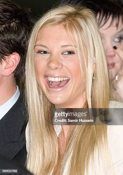 Chelsy Davy watches Prince Harry with his flying badges at the Museum of Army Flying on May 7, 2010 in Middle Wallup, England.