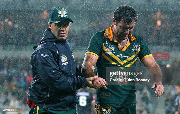 Cameron Smith of the Kangaroos leaves the ground after injuring his elbow during the ARL Test match between the Australian Kangaroos and the New...