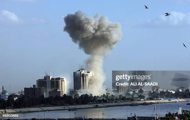 Smoke rises hundreds of metres into the sky following an explosion in the area near Baghdad's Palestine Hotel on January 25, 2010. Three massive...