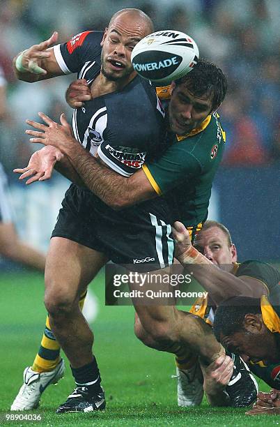 Sam Rapira of the Kiwis is tackled by Cameron Smith of the kangaroos during the ARL Test match between the Australian Kangaroos and the New Zealand...