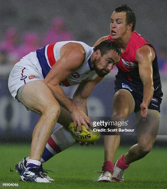 Ben Hudson of the Bulldogs picks the ball up during the round seven AFL match between the Melbourne Demons and the Western Bulldogs at Melbourne...