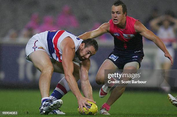 Ben Hudson of the Bulldogs picks the ball up during the round seven AFL match between the Melbourne Demons and the Western Bulldogs at Melbourne...