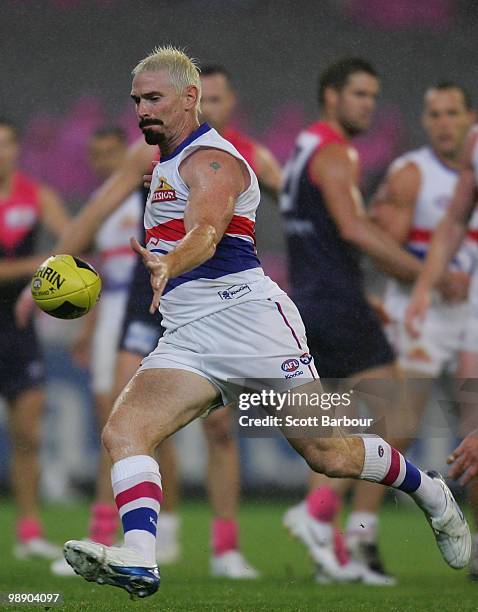 Jason Akermanis of the Bulldogs kicks the ball during the round seven AFL match between the Melbourne Demons and the Western Bulldogs at Melbourne...