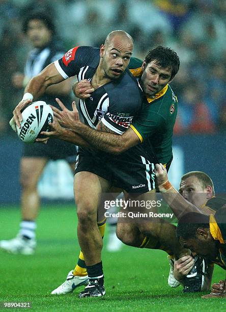 Sam Rapira of the Kiwis is tackled by Cameron Smith of the kangaroos during the ARL Test match between the Australian Kangaroos and the New Zealand...