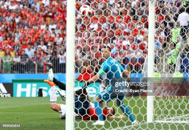 Sergey Ignashevich of Russia scores an own goal to put Spain in front 1-0 during the 2018 FIFA World Cup Russia Round of 16 match between Spain and...