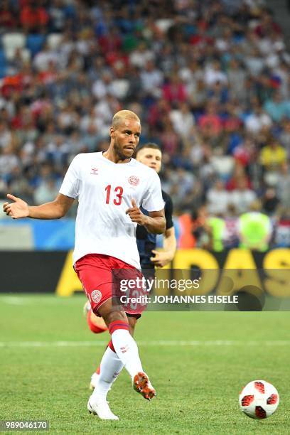 Denmark's defender Mathias Jorgensen kicks the ball during the Russia 2018 World Cup round of 16 football match between Croatia and Denmark at the...