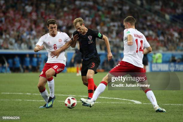 Andreas Christensen of Denmark battles for possession with Ivan Strinic of Croatia during the 2018 FIFA World Cup Russia Round of 16 match between...