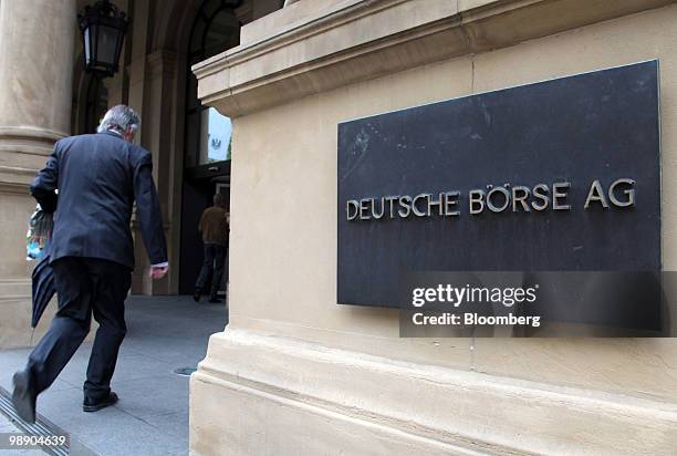 Businessman enters the Frankfurt Stock Exchange in Frankfurt, Germany, on Friday, May 7, 2010. European stocks sank for a fourth day after U.S....