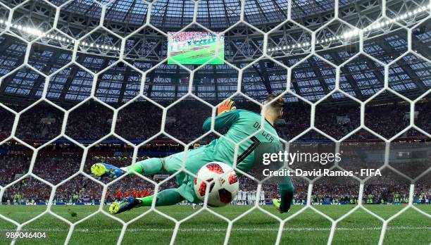 Aleksandr Golovin of Russia scores past David De Gea of Spain his team's third penalty in the penalty shoot out during the 2018 FIFA World Cup Russia...