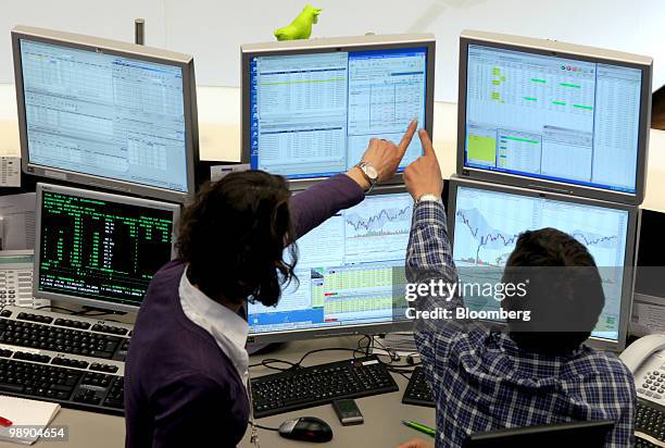 Traders work at the Frankfurt Stock Exchange in Frankfurt, Germany, on Friday, May 7, 2010. European stocks sank for a fourth day after U.S. Shares...