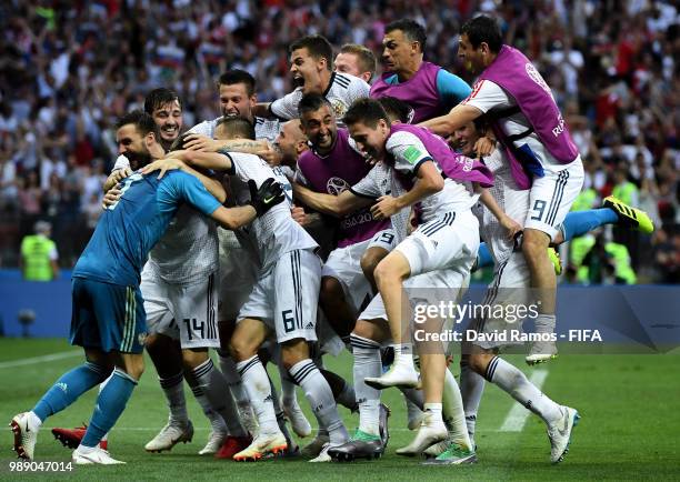 Akinfeev of Russia is celebrated by team mates following the penalty shoot out during the 2018 FIFA World Cup Russia Round of 16 match between Spain...