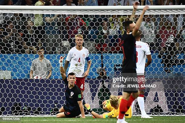 Croatia's forward Ivan Perisic appeals to the referee during the Russia 2018 World Cup round of 16 football match between Croatia and Denmark at the...