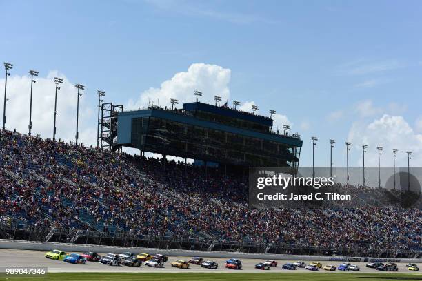Paul Menard, driver of the Menards/Sylvania Ford, and Ryan Blaney, driver of the PPG Ford, lead the field to start the Monster Energy NASCAR Cup...