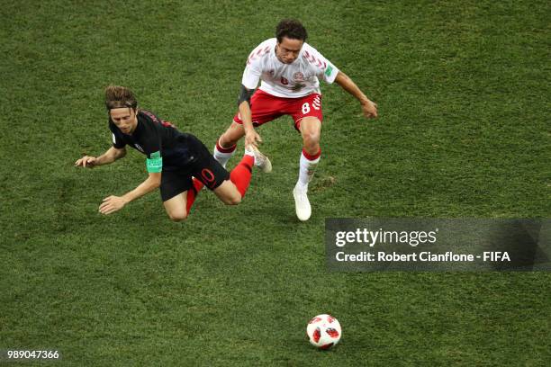 Luka Modric of Croatia is challenged by Thomas Delaney of Denmark during the 2018 FIFA World Cup Russia Round of 16 match between Croatia and Denmark...