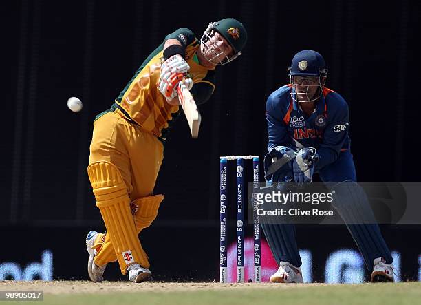 David Warner of Australia hits a six during the ICC World Twenty20 Super Eight match between Australia and India at the Kensington Oval on May 7,...
