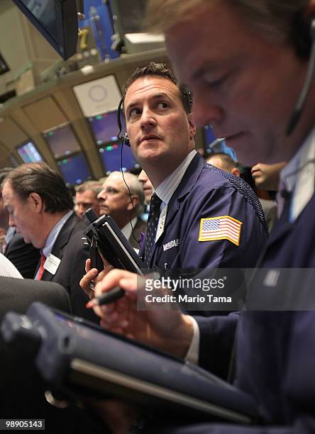 Traders work on the floor of the New York Stock Exchange after the opening bell May 7, 2010 in New York City. Stocks began the session mixed after a...
