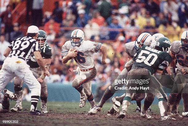 Playoffs: Miami Dolphins QB David Woodley in action vs New York Jets. Mud Bowl. Miami, FL 1/23/1983 CREDIT: Andy Hayt