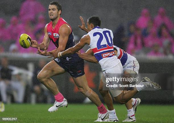 Jared Rivers of the Demons runs with the ball during the round seven AFL match between the Melbourne Demons and the Western Bulldogs at Melbourne...