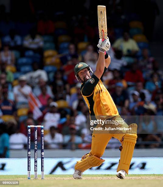 Cameron White of Australia hits out during The ICC World Twenty20 Super Eight Match between Australia and India played at The Kensington Oval on May...