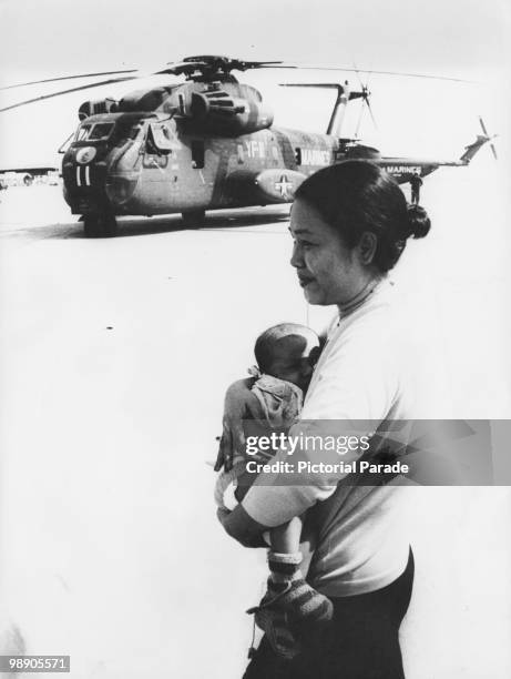 Cambodian refugee and her child at an American military base at U-Tapao, Thailand, 13th April 1975. The woman has been evacuated from Phnom Penh,...