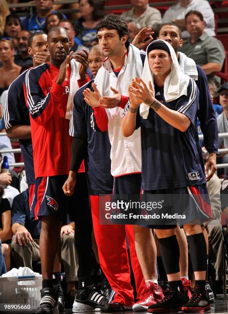 Joe Smith, Maurice Evans, Zaza Pachulia and Mike Bibby of the Atlanta Hawks cheer for their team mates during play against the Orlando Magic in Game...