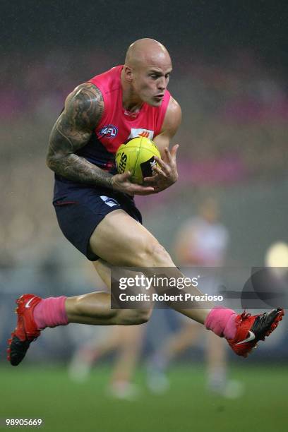 Nathan Jones of the Demons marks the ball during the round seven AFL match between the Melbourne Demons and the Western Bulldogs at Melbourne Cricket...