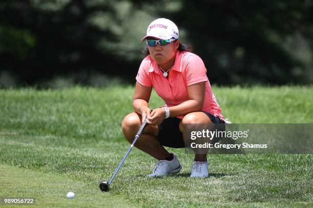 Nasa Hataoka of Japan reads a putt on the 18th green during the final round of the 2018 KPMG PGA Championship at Kemper Lakes Golf Club on July 1,...