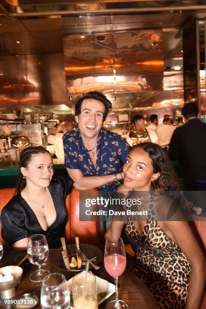 Nick Grimshaw poses with Mercy Cutler and guest at The Grimmy Brunch Series at Sexy Fish on July 1, 2018 in London, England.