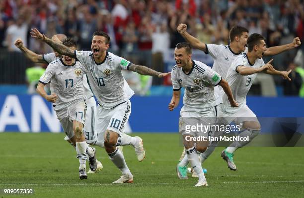 Fyodor Smolov celebrates when Russia win the penalty shoot out during the 2018 FIFA World Cup Russia Round of 16 match between Spain and Russia at...