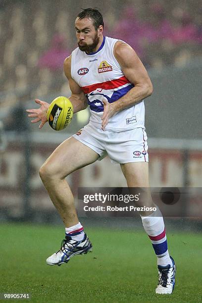 Ben Hudson of the Bulldogs gathers the ball during the round seven AFL match between the Melbourne Demons and the Western Bulldogs at Melbourne...