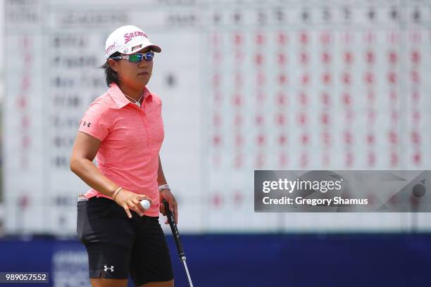 Nasa Hataoka of Japan acknowledges fans after a par on the 18th green during the final round of the 2018 KPMG PGA Championship at Kemper Lakes Golf...