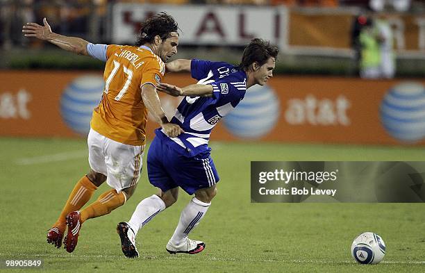 Zach Loyd of FC Dallas is shadowed by Mike Chabala of the Houston Dynamo at Robertson Stadium on May 5, 2010 in Houston, Texas.