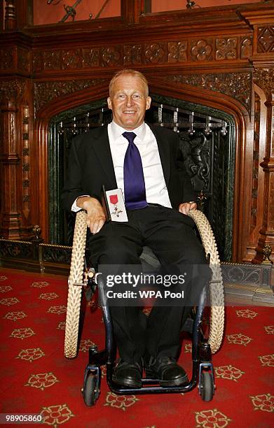 David Constantine from Bristol, after he was made an MBE by Britain's Queen Elizabeth II for services to disabled people,during an investiture...