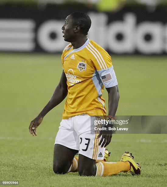 Dominic Oduro of the Houston Dynamo kneels against FC Dallas at Robertson Stadium on May 5, 2010 in Houston, Texas.