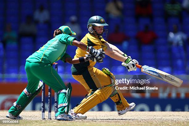 Jessica Cameron of Australia hits square as South Africa wicketkeeper Trisha Chetty looks on during the ICC T20 Women's World Cup Group A match...