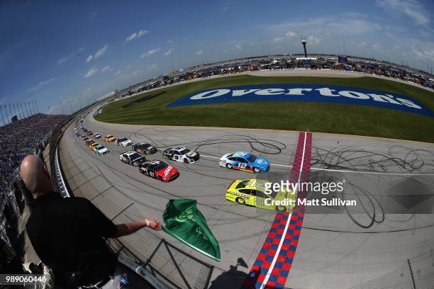 Paul Menard, driver of the Menards/Sylvania Ford, and Ryan Blaney, driver of the PPG Ford, lead the field to the green flag to start the Monster...
