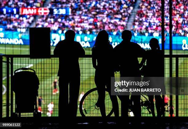 Fans watch the Russia 2018 World Cup round of 16 football match between Russia and Spain at the FIFA Fan Fest in Rostov-on-Don on July 1, 2018.