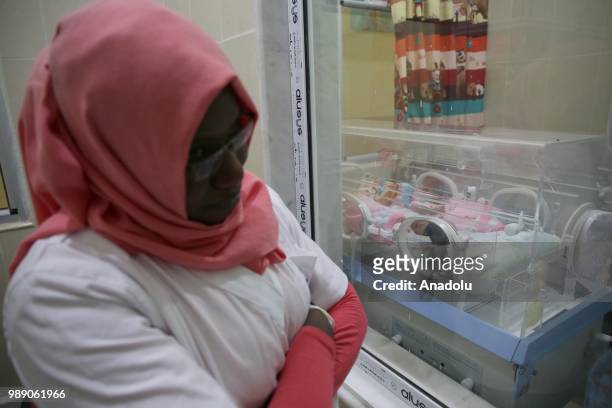 An African migrant baby patient, who will be repatriated to their countries, lies inside of a incubator at Tamanrasset Hospital of the refugee camp...