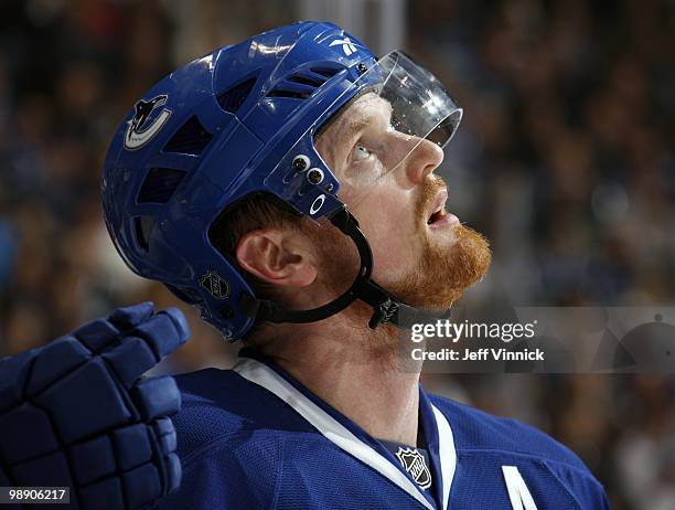 Henrik Sedin of the Vancouver Canucks looks on from the bench in Game Three of the Western Conference Semifinals against the Chicago Blackhawks...