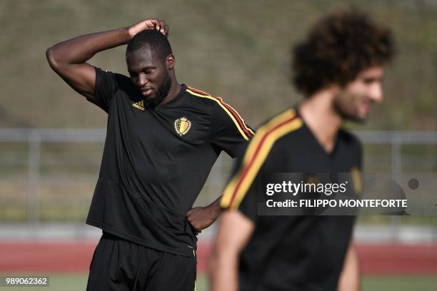 Belgium's forward Romelu Lukaku gestures beside midfielder Marouane Fellaini during a training session in Rostov-on-Don on July 1 on the eve of their...
