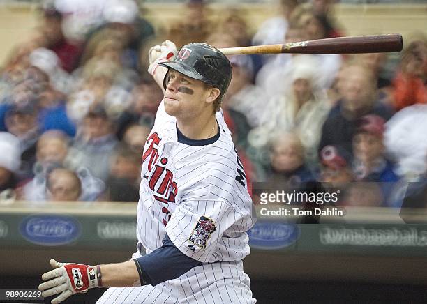 Justin Morneau of the Minnesota Twins follows through on a hit in a game against the Detroit Tigers at Target Field on May 5, 2010 in Minneapolis, MN.