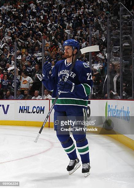 Canuck fans wave towels as Daniel Sedin of the Vancouver Canucks skates by in Game Three of the Western Conference Semifinals against the Chicago...
