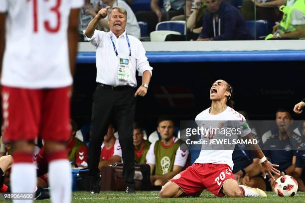 Denmark's forward Yussuf Poulsen reacts next to Denmark's coach Age Hareide after missing a goal opportunity during the Russia 2018 World Cup round...