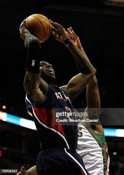 Marvin Williams of the Atlanta Hawks puts up a shot against John Salmons of the Milwaukee Bucks in Game Four of the Eastern Conference Quarterfinals...